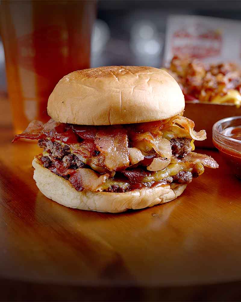 Butcher’s Burger with melted cheese on a toasted bun